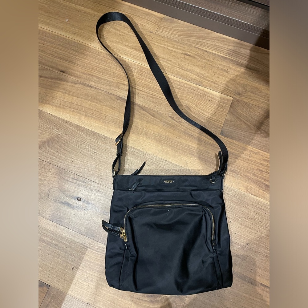Tumi nylon cross body bag with gold accents